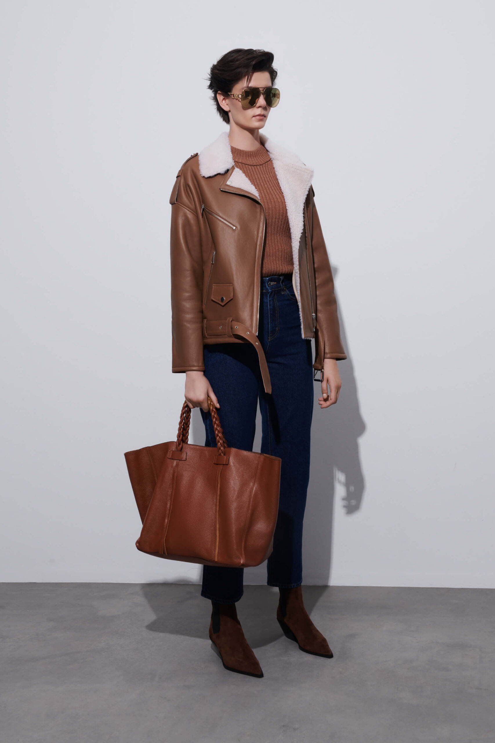 Brown shearling jacket handcrafted from genuine sheepskin — a timeless winter investment blending warmth, durability, and quiet luxury.