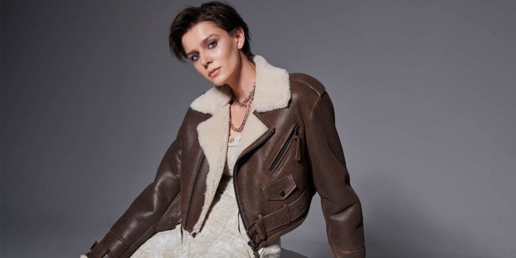 a woman in a leather jacket