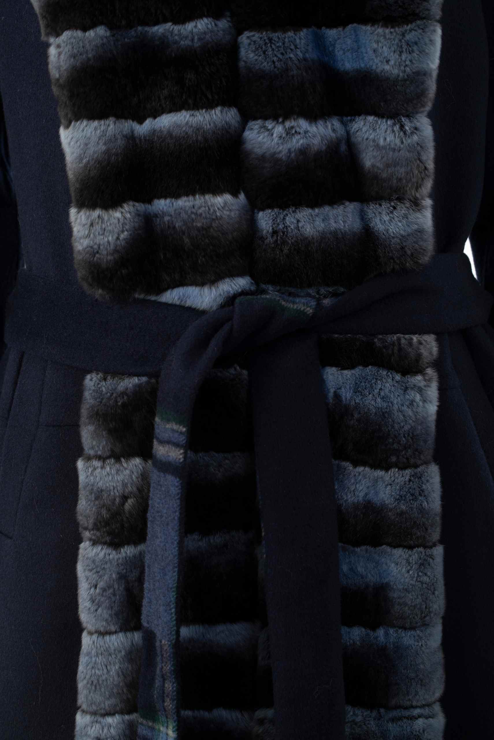 Luxury handcrafted fur coat with horizontal panels and belt detail, showcasing premium fur texture and craftsmanship in Istanbul
